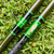 Nick's Custom Rods 2026 Nick's Custom Rods - CTS 1305 Conventional, fishing rod with green decorative wrapping and fish illustration, lying on green grass