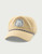 HUK Patch Performance Rope Hat, beige performance cap with embroidered logo patch and rope detail on brim.