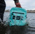 TOADFISH Toadfish Sealed Waterproof Backpack & Sling, turquoise waterproof backpack submerged in water showing durability and water resistance.