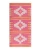 Sand Cloud Beach Towels, vibrant pink and yellow patterned beach towel with geometric and eye-shaped designs.