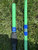 Full Send Rod Co. Custom CTS 1205 fishing rods, green rods with blue accents on the grass.