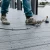 Toadfish Toadfish Stono Combo, image of a person fishing on a wooden dock with a fishing rod and reel.