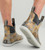 HUK Huk Rogue Wave Boots, camouflage waterproof ankle boots with slip-resistant soles and pull-on loops for outdoor and fishing activities.