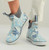 HUK Huk Womens Rogue Wave Camo Boot, close-up of stylish waterproof slip-on boots with a blue and white camo pattern and gray ankle collar.