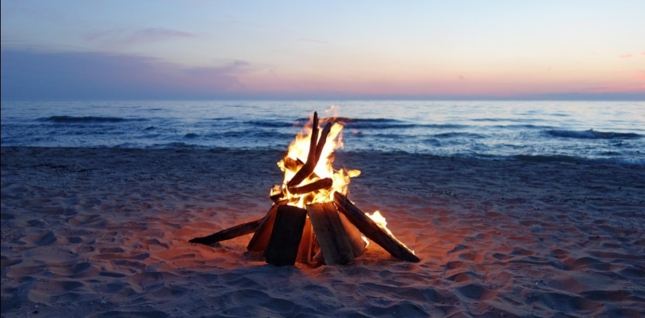 Beach bonfire at sunset
