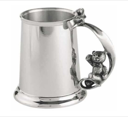 Pewter baby cup with teddy bear handle and ribbon.