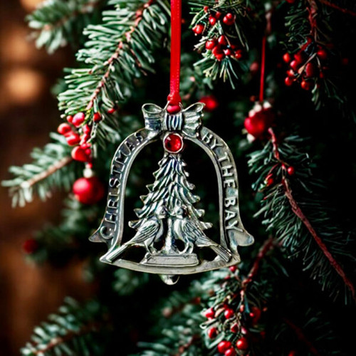 Pewter ornament with turtle doves and red jewel.