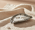 Pewter oyster shell salt cellar with spoon.