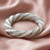 Handcrafted pewter rope design napkin ring.