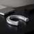 Handcrafted pewter horseshoe paperweight with elegant design.