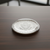 Glass domed paperweight with engraved seal.