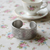 Silver bracelet with engraved carnations design.