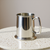 Pewter tankard with glass bottom and handle.