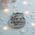 Pewter lighthouse ornament with intricate details.