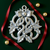 Pewter ornament with intertwined rings and holly.