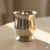 Pewter tulip-shaped vase, 3 1/4 inches tall.
