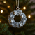Pewter wreath ornament with pine and pear details.