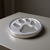 Pewter paw print paperweight with tumbled finish.