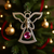 Silver angel ornament with pink jewel.