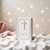 Chrome-plated book-shaped keepsake box with cross.