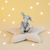 Pewter-coated Hazel Rabbit figurine on star cushion.