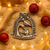 Pewter Christmas ornament with intricate decoy design.