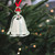 Engraved silver bell ornament with vibrant red ribbon.