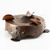 Copper ashtray with strapwork and rivet details.