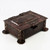 Copper desk box with strapwork and riveted detailing.