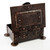 Copper desk box with strapwork and riveted detailing.