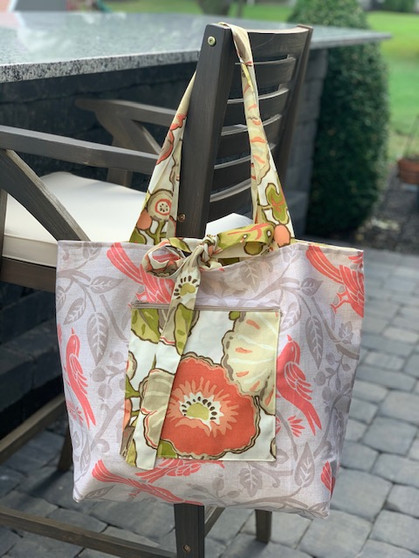 Flower and tan beach bag
