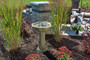 The solar bird bath water fountain, with an olive green finish, is made from Glass Fiber Reinforced Concrete.