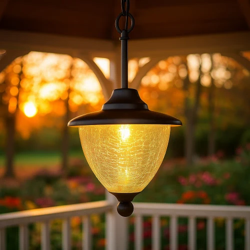 Solar chandelier for gazebos and cupolas is made from powder coated cast aluminum, with a Black finish, and crackle glass globe.