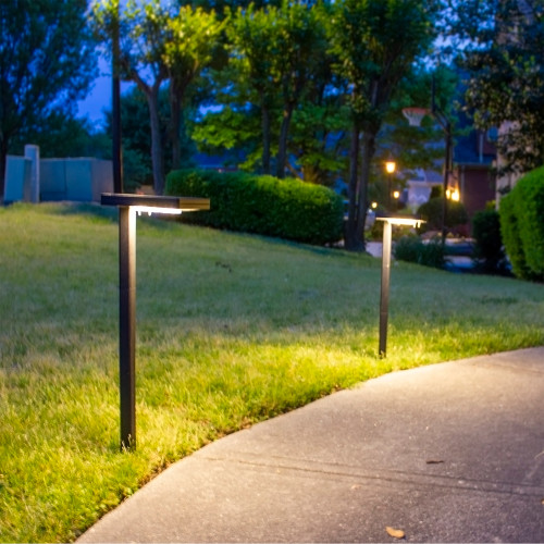 Dark Bronze solar walkway light is made from aluminum, with a powder coated finish, and stands over 20 inches high installed into the ground.