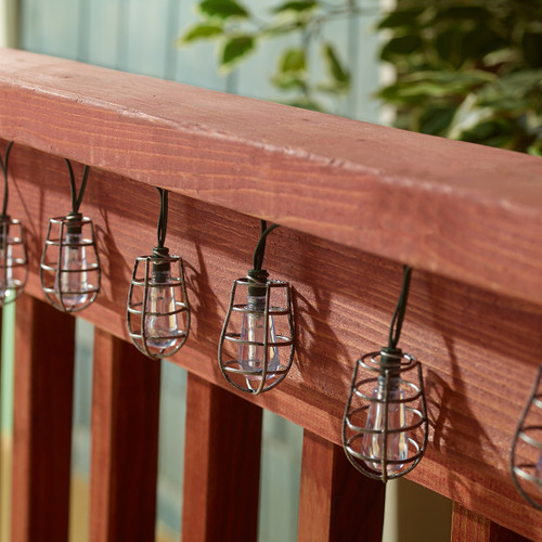 Solar string lights for patio have 20 Edison-style Pewter Metal Cornelius cage toppers, that surround one hanging LED bulb.