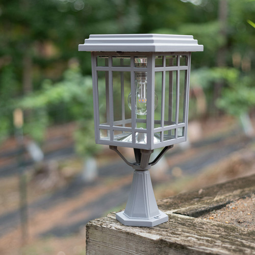 Solar coach light is made from powder coated cast aluminum, glass lenses, and has a concrete gray finish