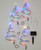 The set of 4 solar Christmas trees includes 4 spiral trees with mulit-color LED lights attached, 4 black plastic ground stakes, and a solar panel and ground stake.