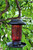 Solar powered bird feeder hangs 15 inches from the tree branch or hook, including the metal chain.