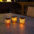 Solar table candles have a flickering flame for a cozy night.