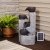 Solar powered cascade fountain, with battery backup, is a 4-tiered aged vessel work of art to enjoy day and night.