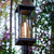 Solar post light lantern has an open design that magnifies the beauty of the minimalist frame, with a splash of the past from the vintage Edison style solar light bulb. Pole is not included with purchase.