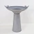 Modern solar powered birdbath fountain is 21 inches in diameter, 25 inches high, and is made from light cement.