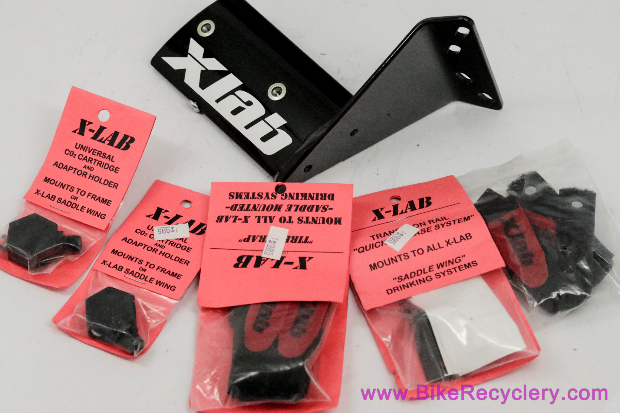 NOS Xlab SaddleWing Rear Bottle Carrier & Accessories Co2 XNuts