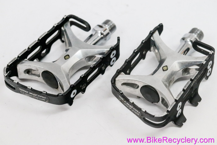 Suntour XC Pro Pedals: WTB Grease Guard - PL-XP01 - Black (Near