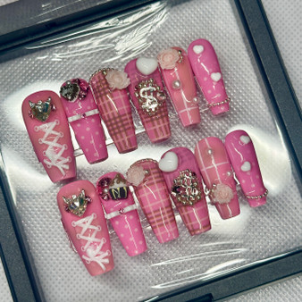 spoiled sweet nail set including plaid, polka dots, bows, and roses