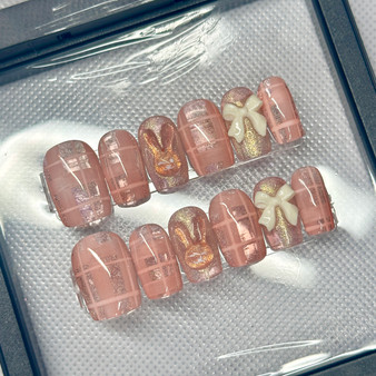 peachy delight nail set featuring plaid design and a 3d bunny