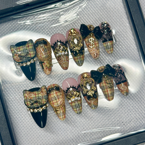 purrfect diva nail set including plaid, cat head, rhinestones, and gold accents