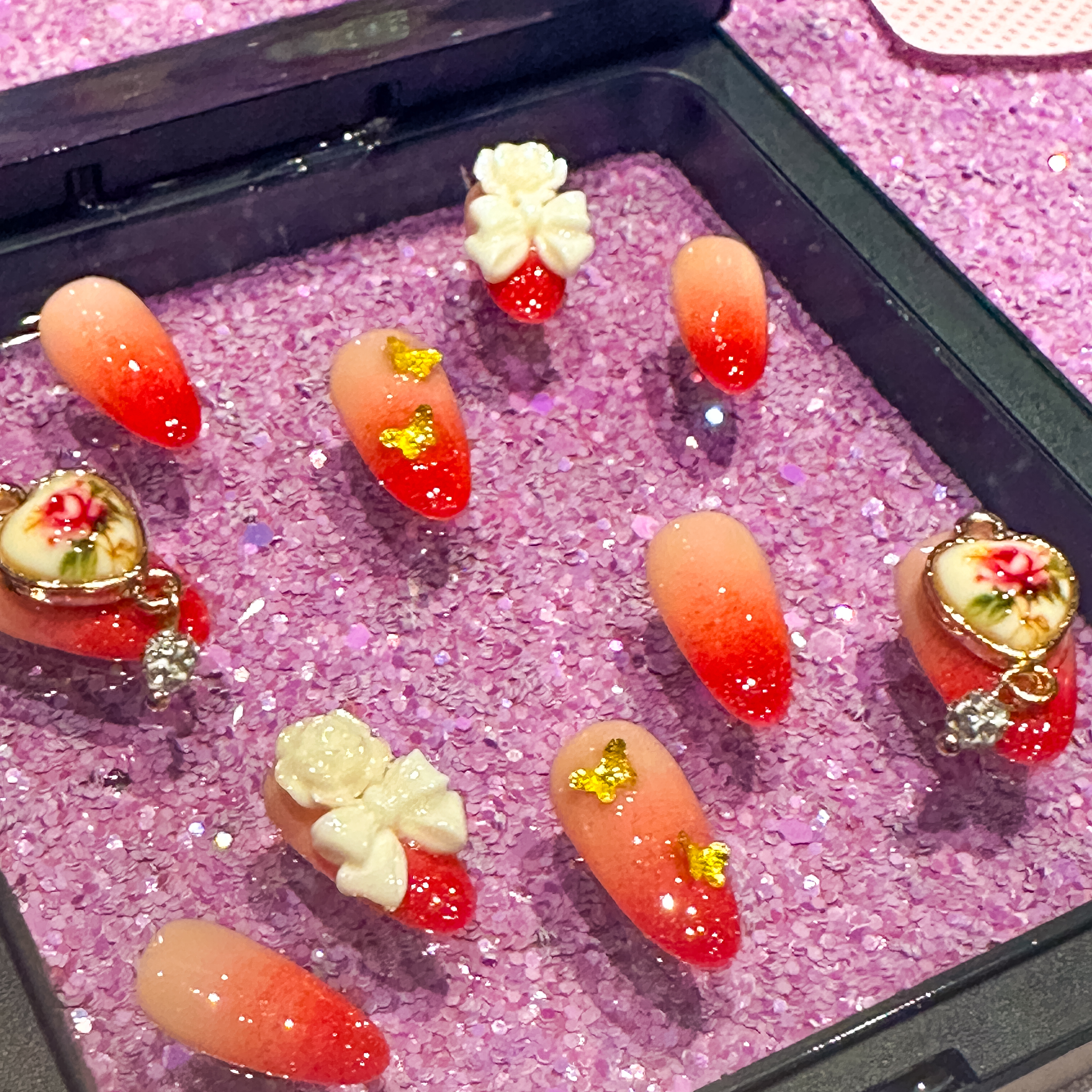Custom Kawaii Red Glitter Nails with Bows, Butterflies, and Porcelain Hearts
