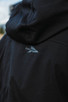 First Spear Wind Cheater Technical Water Resistant Hooded Windbreaker in Black Back Logo Lifestyle First Spear Wind Cheater Technical Water Resistant Hooded Windbreaker in Black Back Logo Lifestyle
