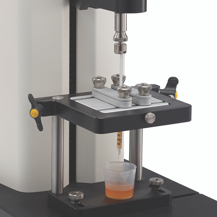 Syringe Test Fixture for measuring the force required to push or pull syringe plunger.